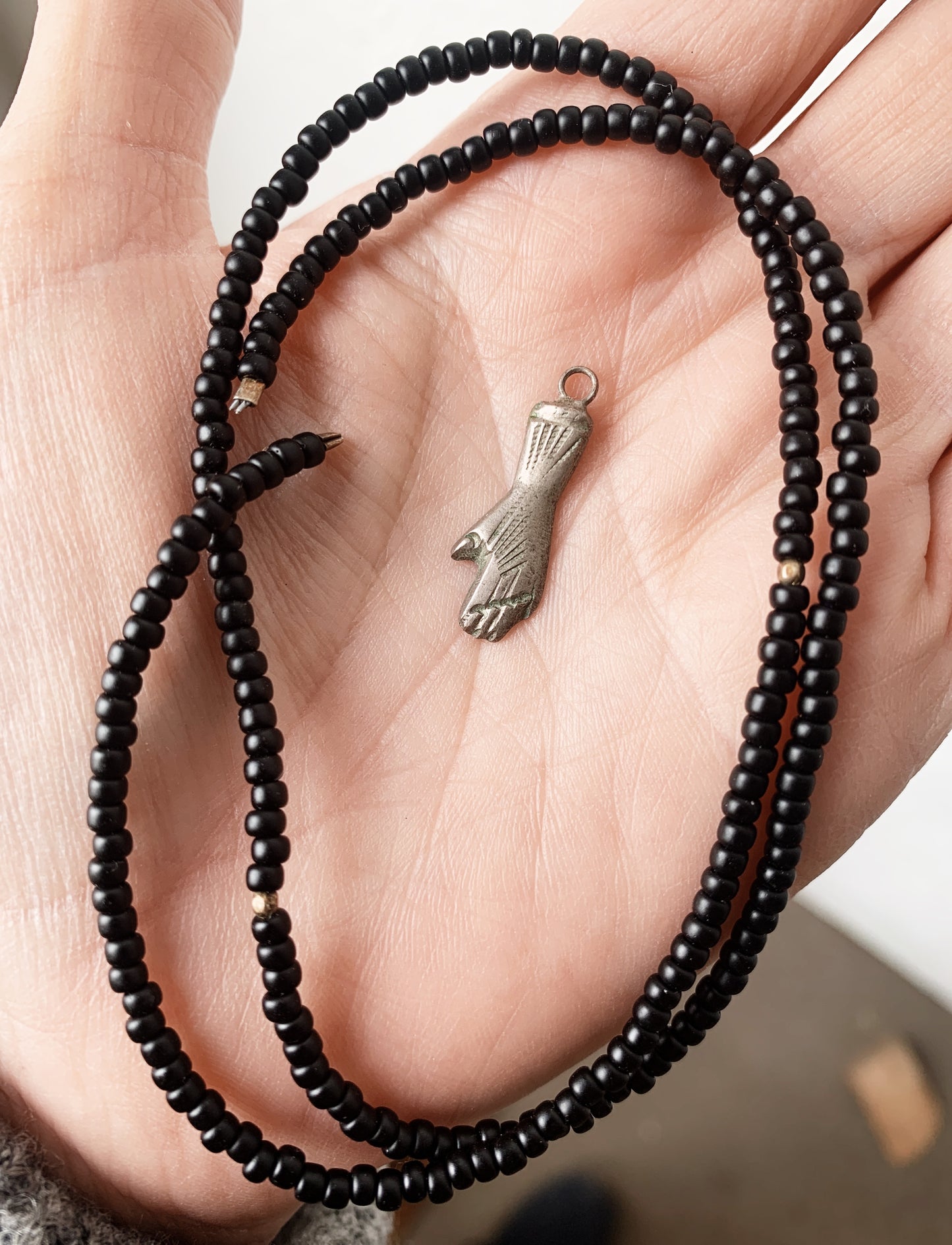 Black Seed Beads and Hand Milagro