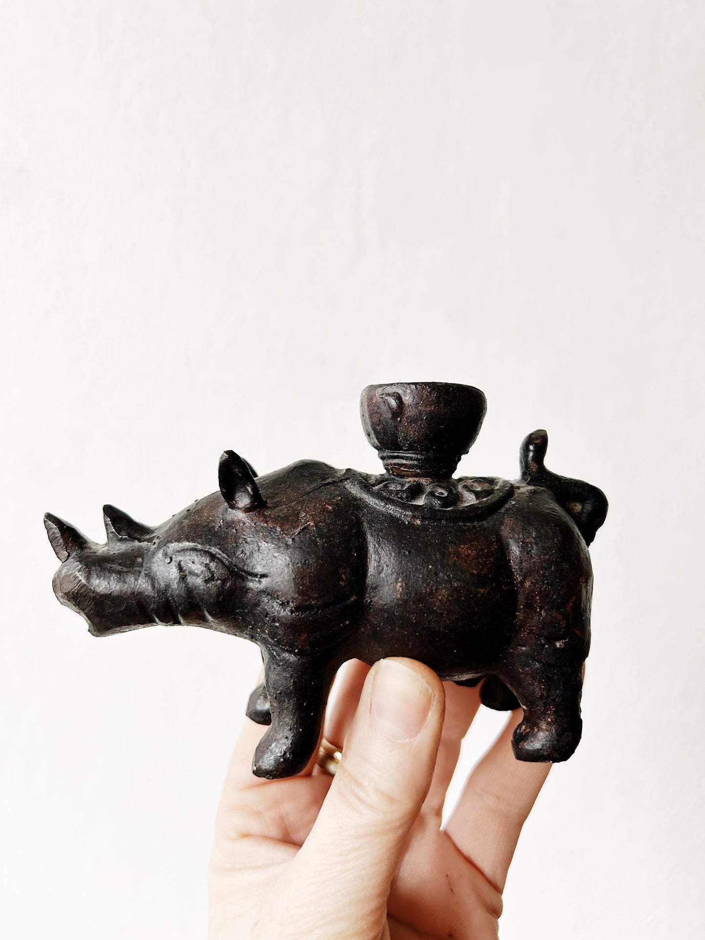 Vintage Pair of Indonesian Cast Iron Rhinoceros Candle Holders